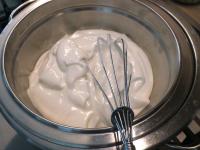 Whip the egg whites with the sugar over the steam...