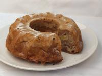 After cooling, tip the cake and sprinkle with...