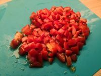 Add finely chopped tomatoes to the pan. Season and...