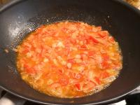 Add white wine. The liquid evaporates gradually,...