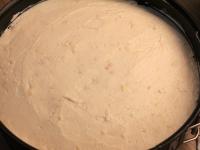 Press the biscuit dough on the bottom of the cake...