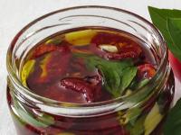 ... and press into a smaller jar. Cover with oil,...