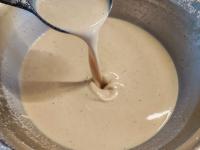 Stir the milk into the thoroughly beaten mixture...