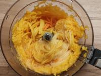 Finely grate the papaya, mango, and carrots, or...
