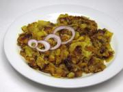 Fried spicy potatoes with onions